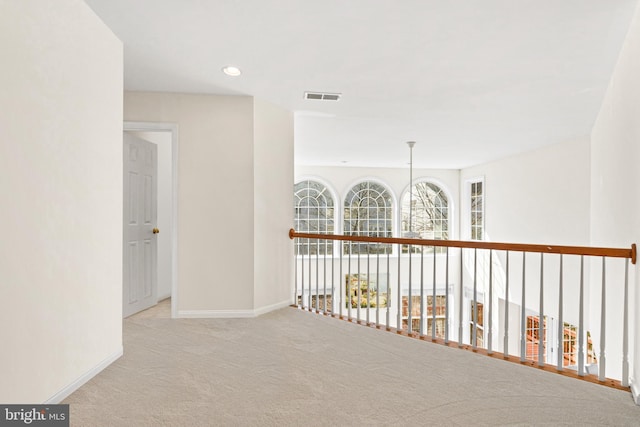 corridor featuring recessed lighting, baseboards, visible vents, and carpet flooring