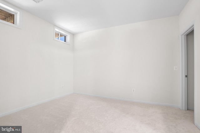 interior space with carpet and baseboards