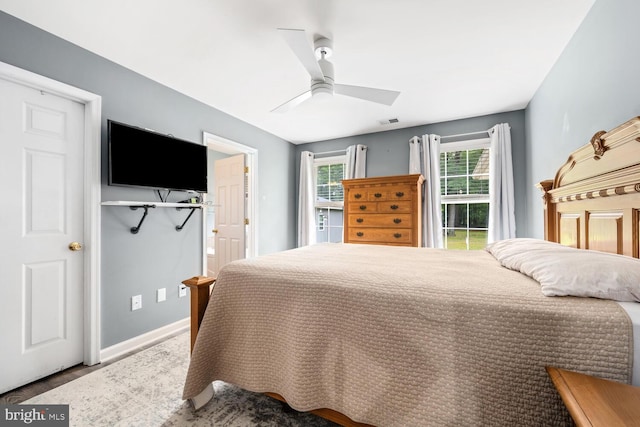 15185 Day Rd, Goldsboro, MD 21636 - bedroom with baseboards, wood finished floors, and a ceiling fan