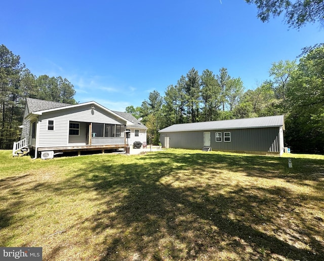 15185 Day Rd, Goldsboro, MD 21636 - rear view of house featuring a lawn, a sunroom, and a shingled roof