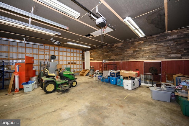 15185 Day Rd, Goldsboro, MD 21636 - garage featuring wooden walls and a garage door opener