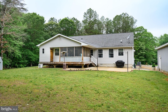 15185 Day Rd, Goldsboro, MD 21636 - rear view of house featuring a patio, a sunroom, a yard, and roof with shingles