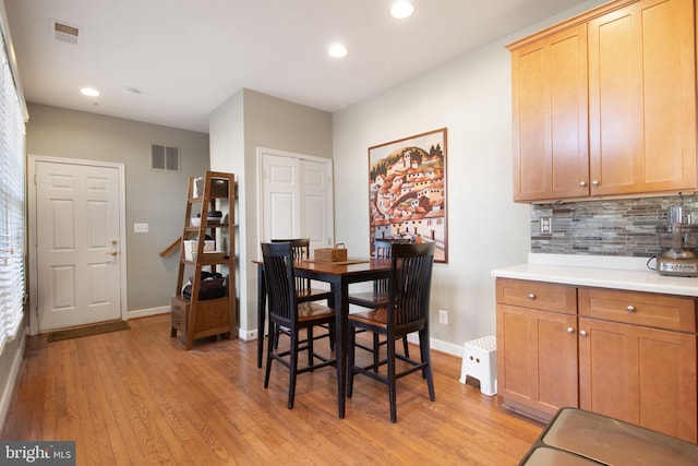 dining area with recessed lighting, visible vents, light wood-style flooring, and baseboards