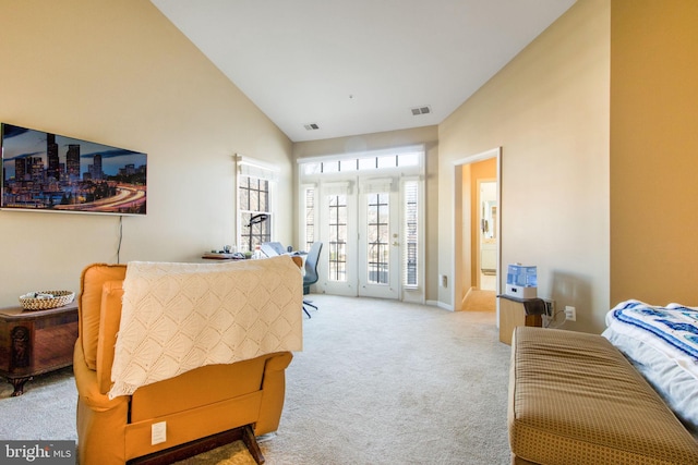 office space featuring visible vents, high vaulted ceiling, and carpet