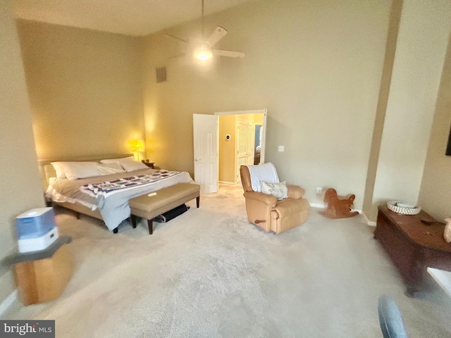 bedroom featuring visible vents and a towering ceiling