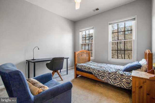 bedroom with visible vents, carpet flooring, a ceiling fan, and baseboards