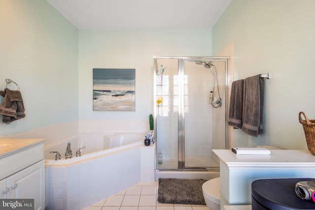 bathroom with vanity, a shower stall, a bath, and tile patterned floors