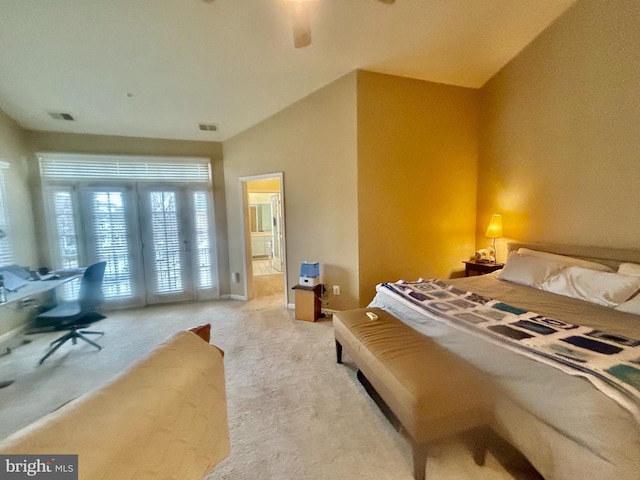 bedroom with visible vents, light colored carpet, connected bathroom, and access to outside