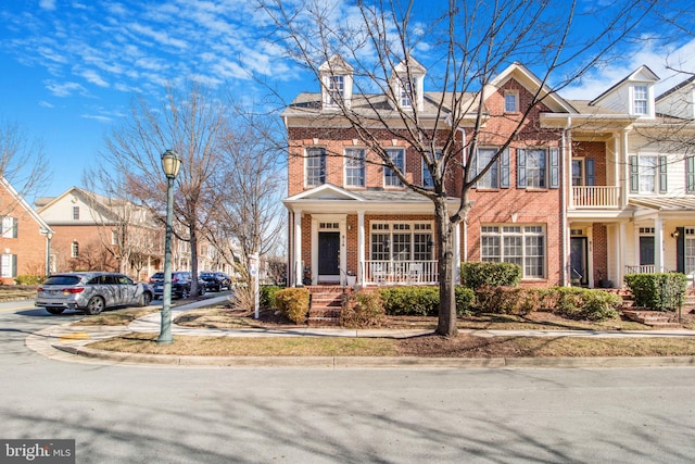 townhome / multi-family property with brick siding