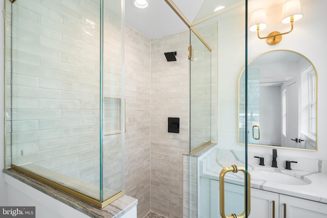 full bath featuring a stall shower, recessed lighting, and vanity