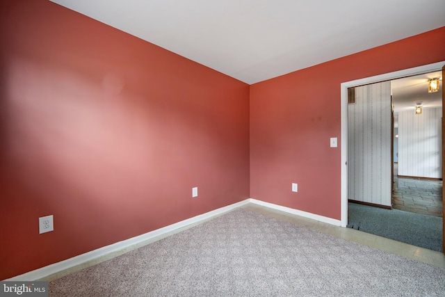 empty room with baseboards