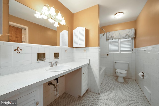 full bath featuring toilet, tile patterned flooring, vanity, washtub / shower combination, and a notable chandelier