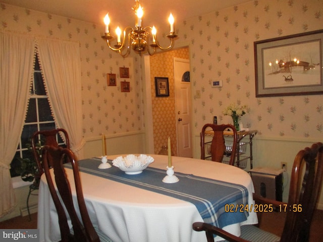 dining room with a notable chandelier and wallpapered walls