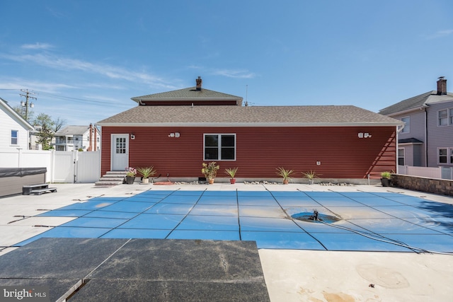 view of swimming pool with entry steps, a patio, fence, and a fenced in pool