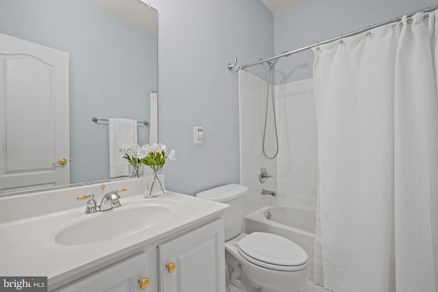 full bath with shower / tub combo, vanity, and toilet