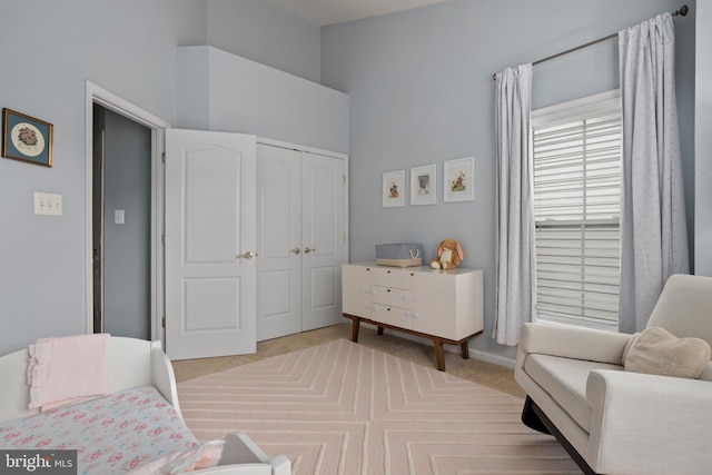 bedroom with carpet floors and a closet