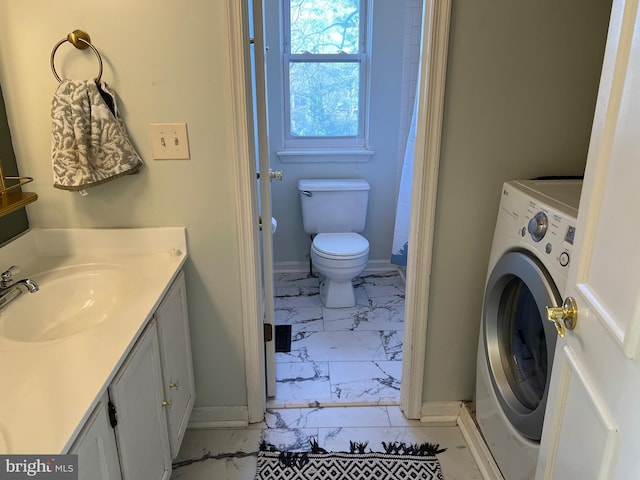 full bath with toilet, vanity, baseboards, marble finish floor, and washer / clothes dryer