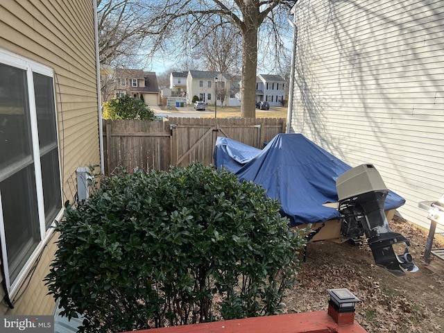 view of yard featuring a residential view and fence