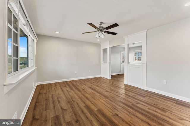 interior space with dark wood-style floors, recessed lighting, a ceiling fan, and baseboards