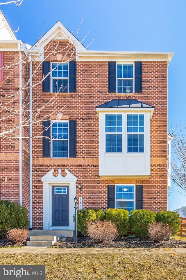 traditional-style house with brick siding