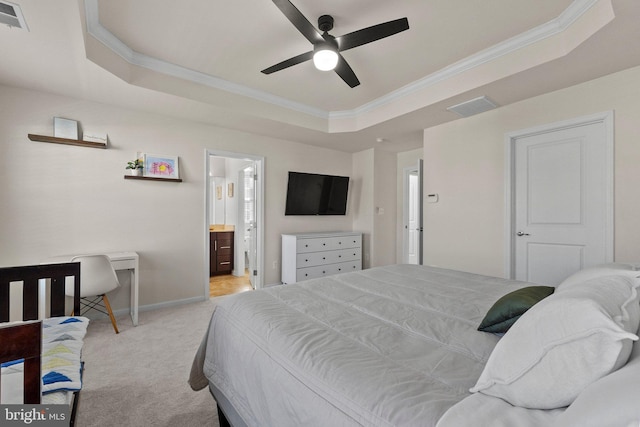 carpeted bedroom featuring baseboards, visible vents, a tray ceiling, and crown molding