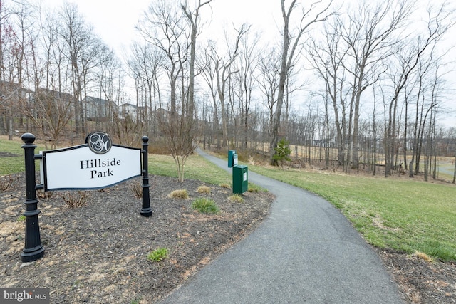 surrounding community featuring a yard and driveway