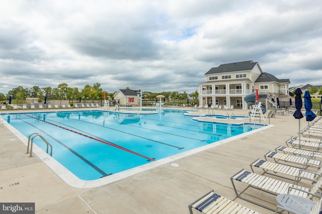 pool featuring a patio and fence