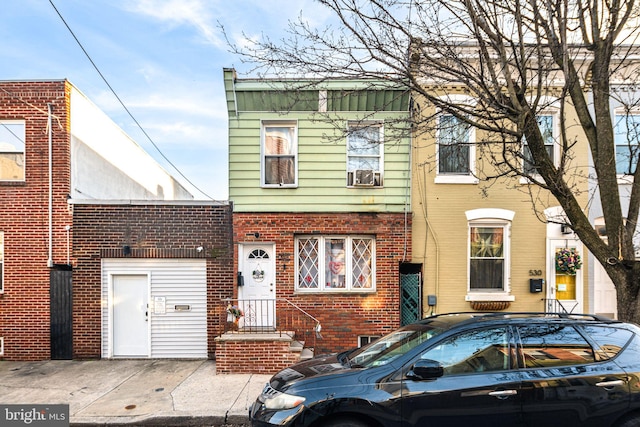 view of front of property featuring brick siding