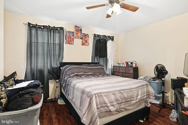 bedroom with a ceiling fan and wood finished floors