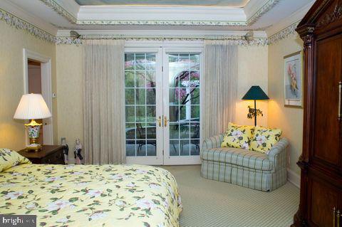 bedroom with carpet and ornamental molding