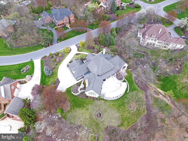 birds eye view of property with a residential view