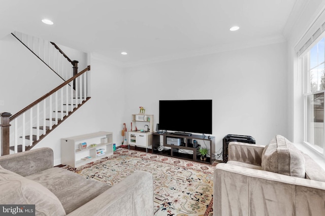 living room featuring stairway, crown molding, and recessed lighting