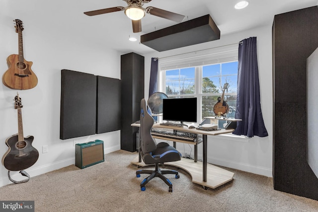 carpeted office space featuring recessed lighting, ceiling fan, and baseboards