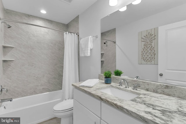 bathroom with visible vents, vanity, toilet, and shower / tub combo with curtain