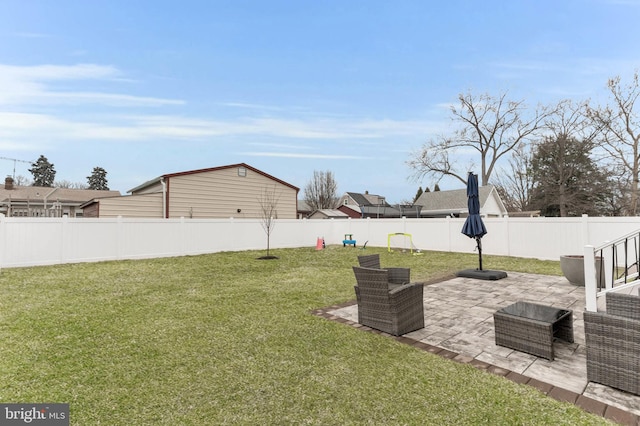 view of yard featuring a patio area and a fenced backyard