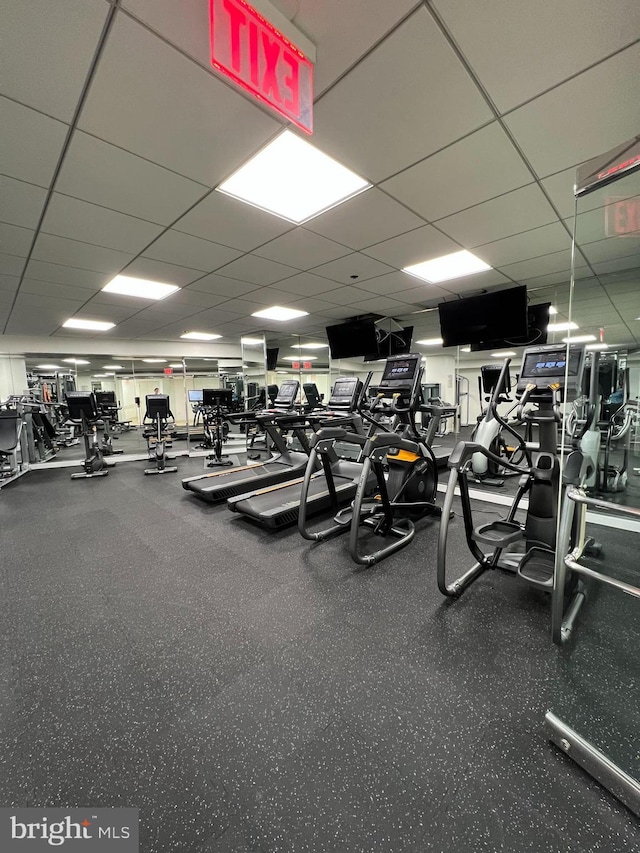 gym featuring a paneled ceiling