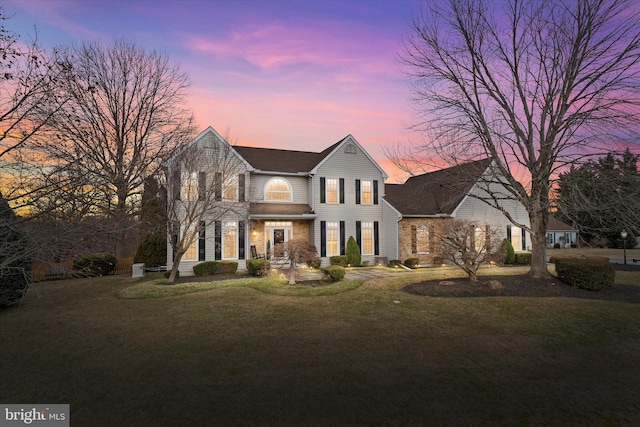 traditional home with a front lawn