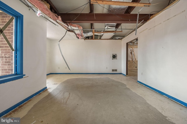 garage featuring visible vents and baseboards