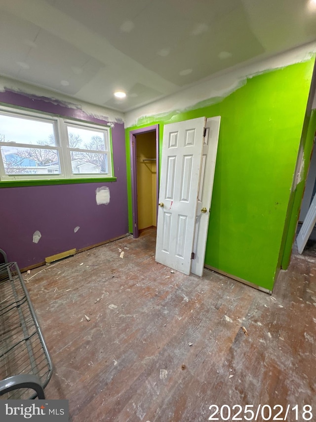 unfurnished bedroom with a closet