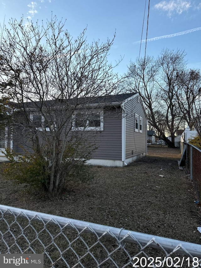 view of property exterior with fence