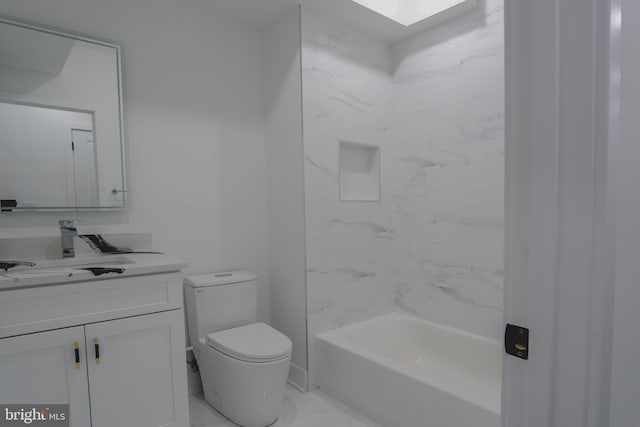 full bathroom featuring toilet, a skylight, bathing tub / shower combination, vanity, and marble finish floor