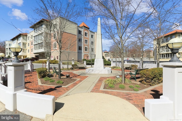 view of community featuring fence