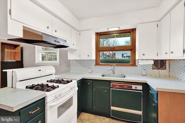 kitchen with white gas stove, white cabinets, a sink, under cabinet range hood, and dishwashing machine