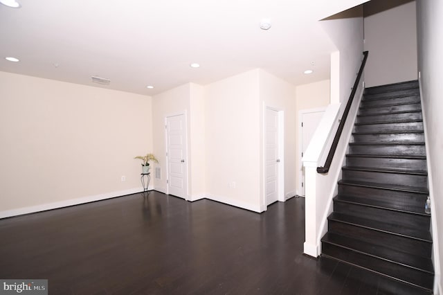 interior space with recessed lighting, visible vents, baseboards, and wood finished floors