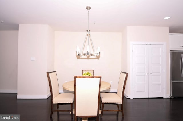 dining room with a chandelier, recessed lighting, dark wood-style floors, and baseboards