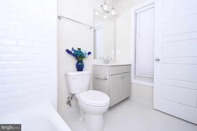 bathroom with toilet, tile patterned flooring, and vanity