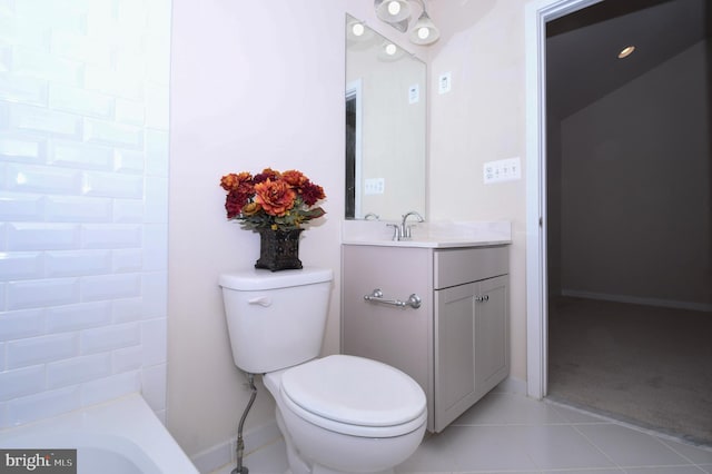 bathroom with toilet, tile patterned flooring, and vanity