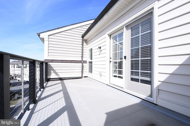 view of patio featuring a balcony