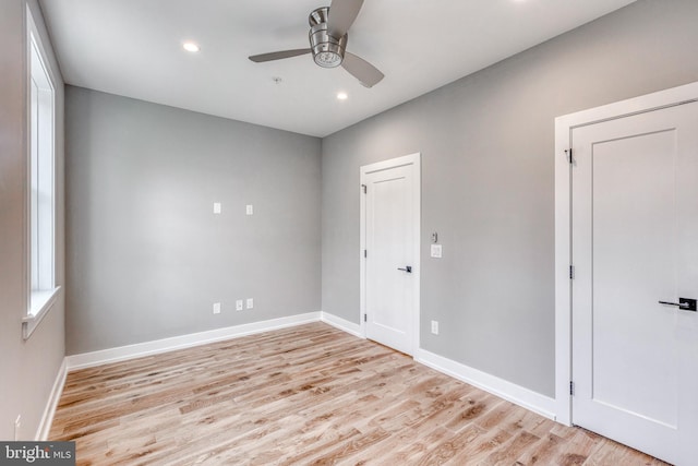 unfurnished room featuring light wood-type flooring, baseboards, a ceiling fan, and recessed lighting