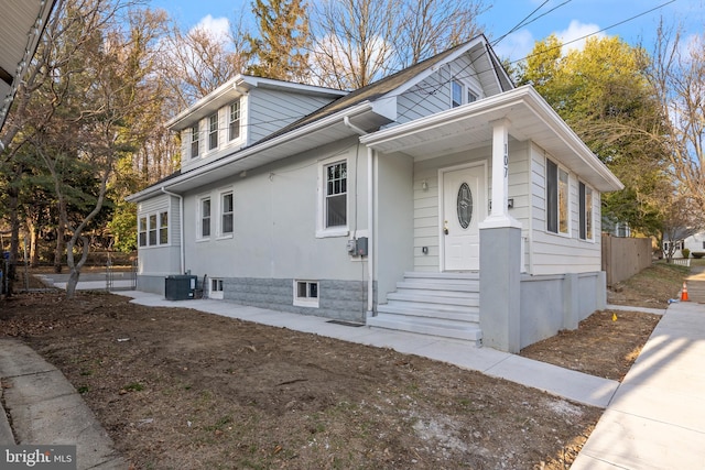 view of front of property featuring entry steps and central air condition unit